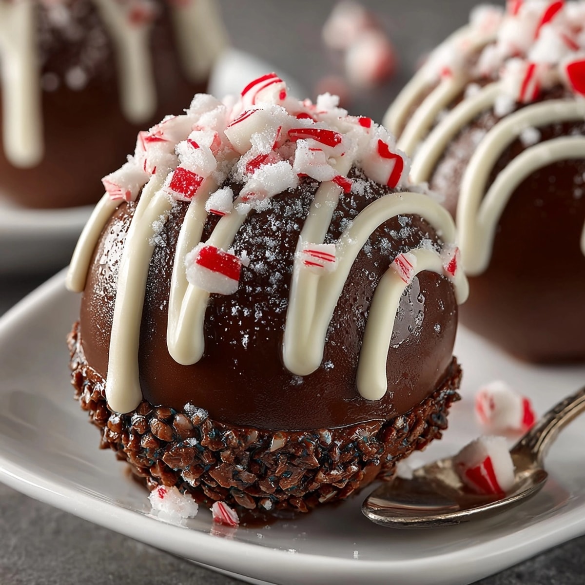 Unmolded Hot Cocoa Bombs sit ready for peppermint filling, showcasing smooth, dark shells.