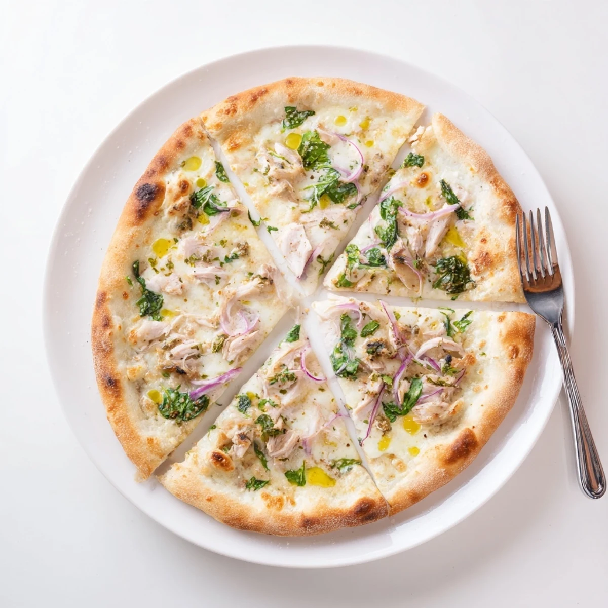 Golden crust of Sage Turkey Gravy Pizza drizzled with sage-infused gravy and fresh spinach.