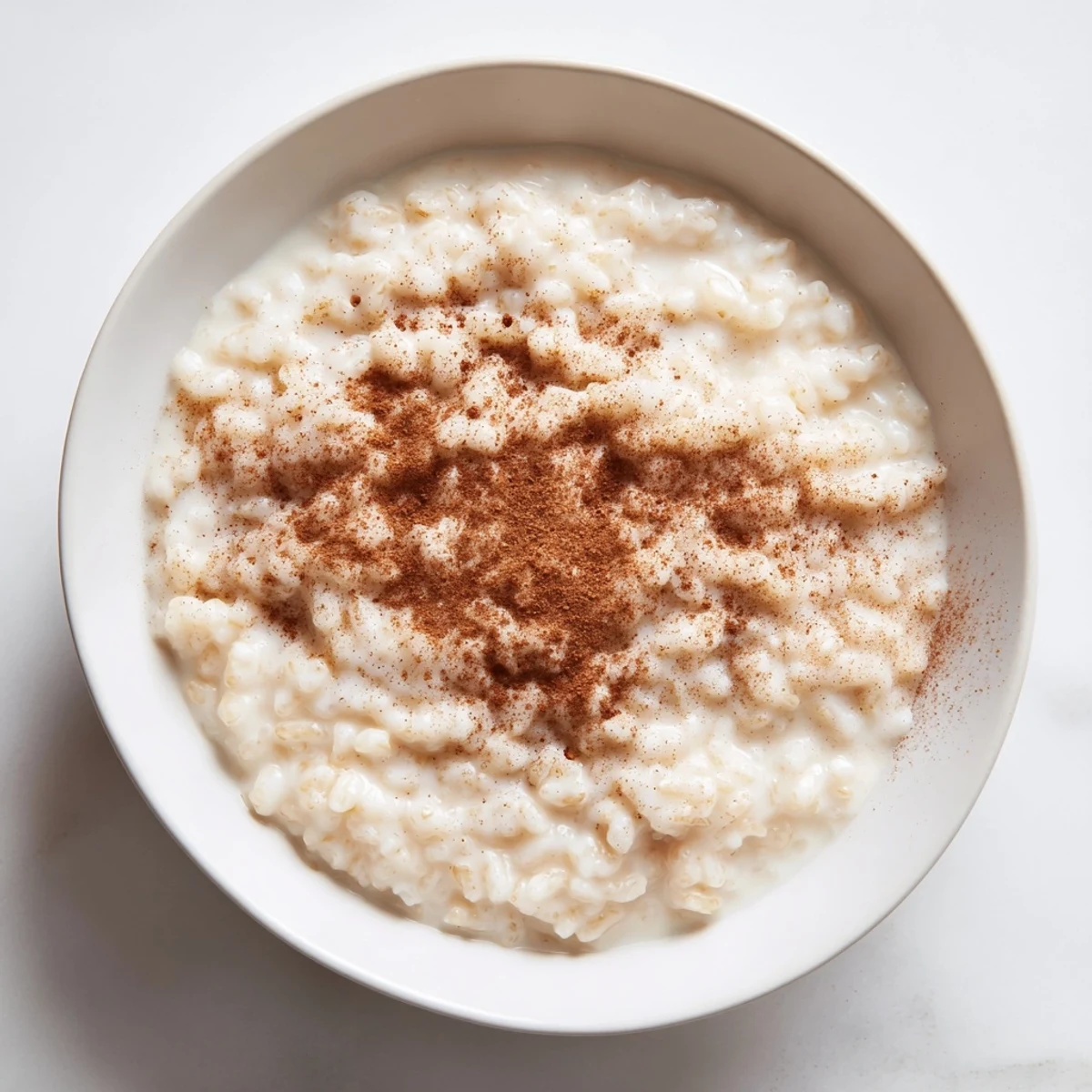 A comforting spoonful of homemade rice pudding, enriched with vanilla and using leftover rice.