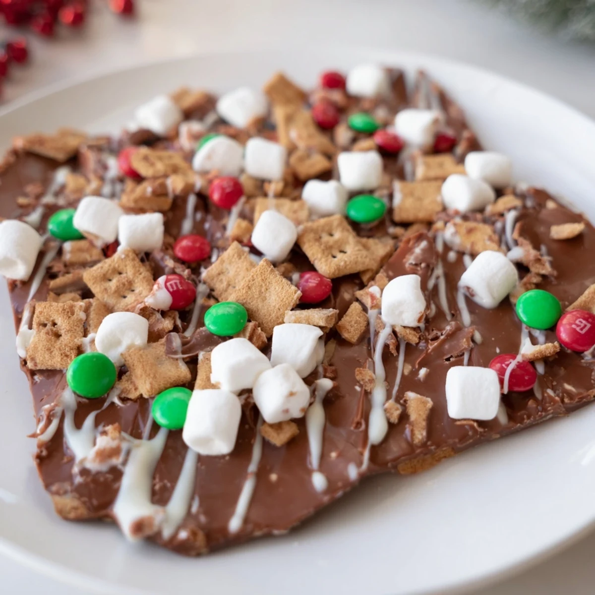 Quick Christmas Smores Bark, studded with colorful candies and melty marshmallows, ready to enjoy as a dessert.