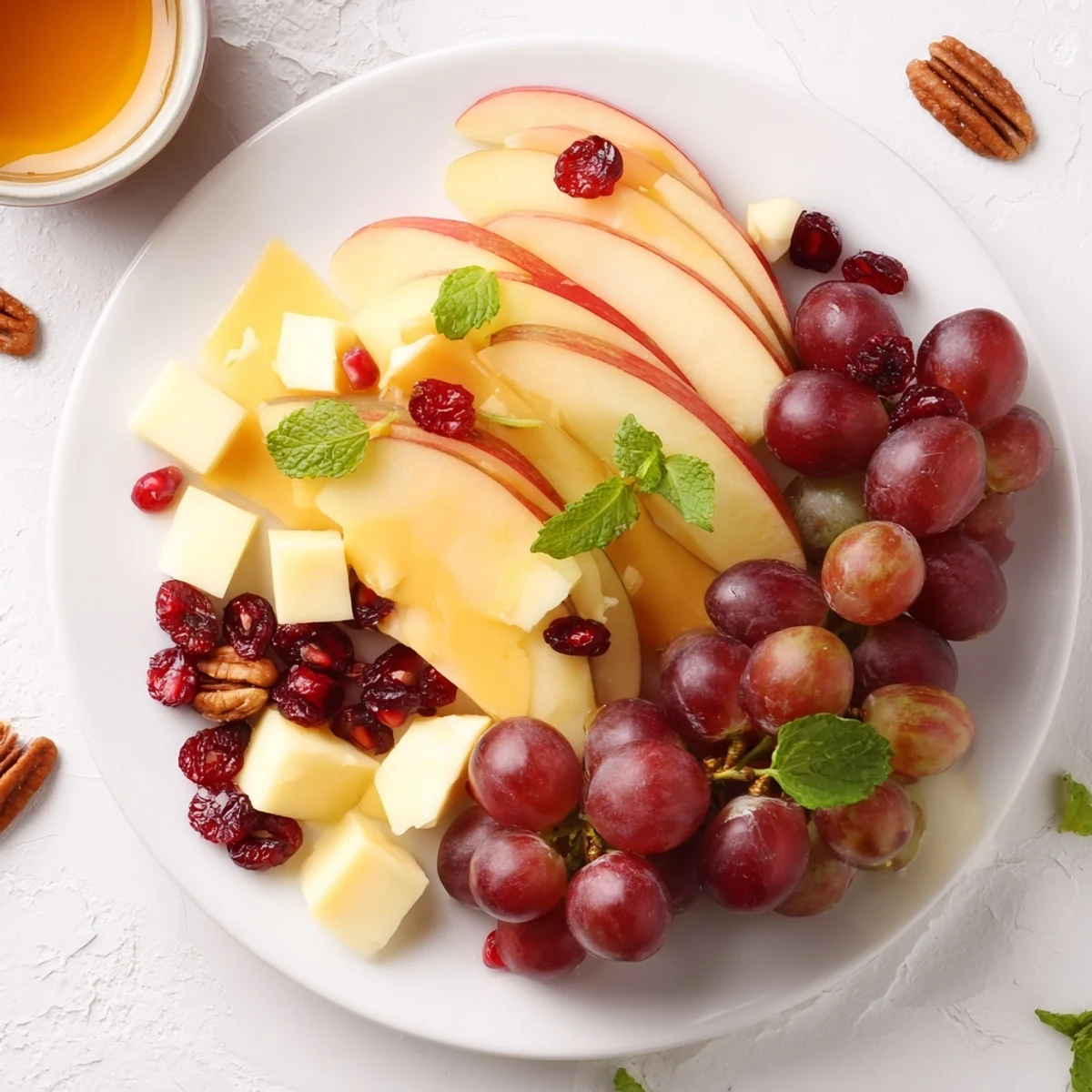 This beautiful Apple Orchard Fruit Board features a variety of fresh, seasonal fruits and cheeses.