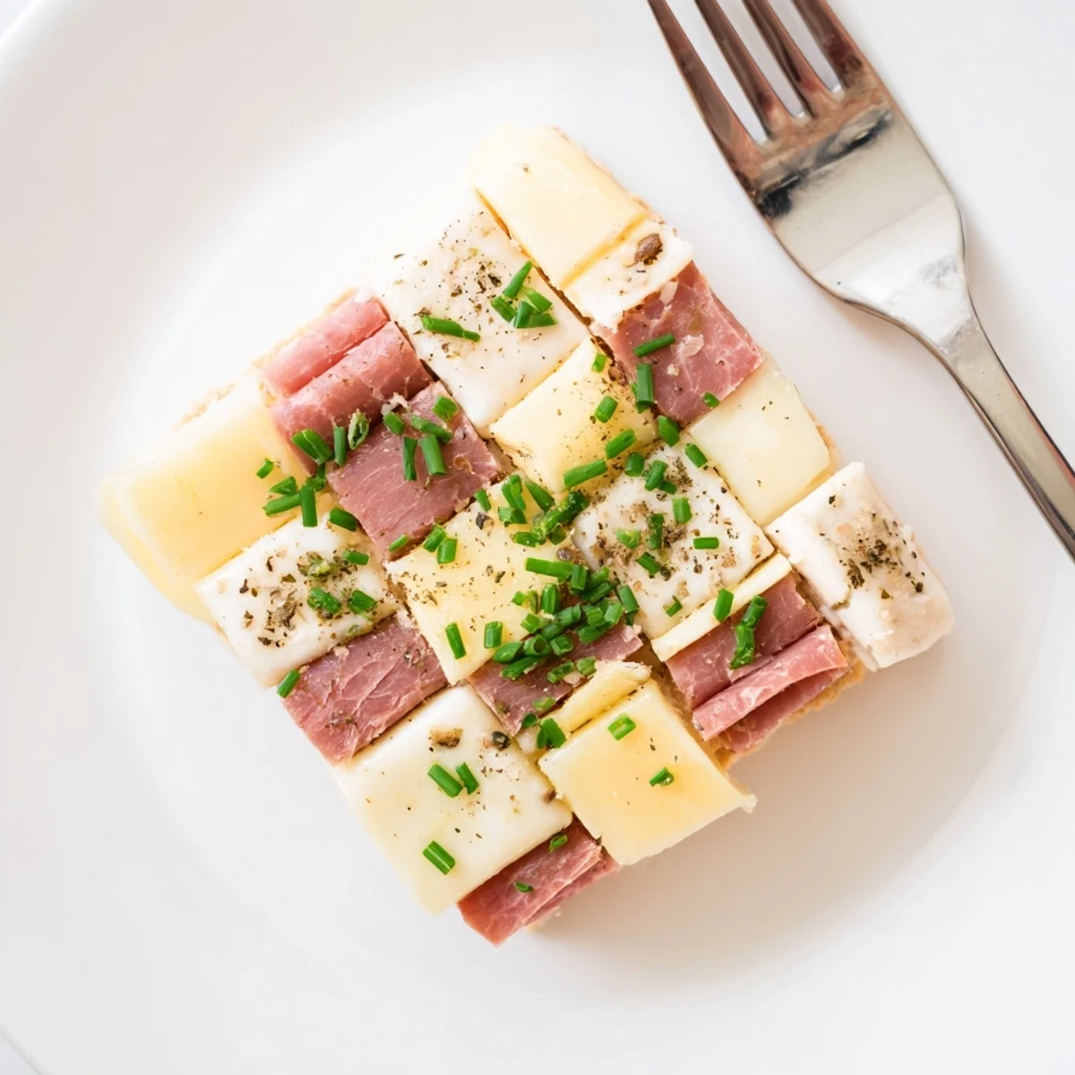 Colorful Checkerboard Picnic Bites, offering a delightful mix of savory meats and cheeses for easy snacking.