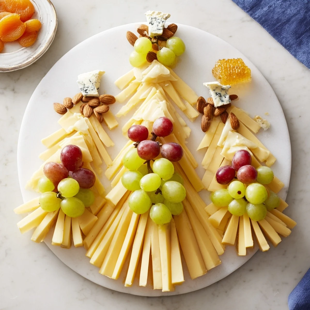 Elegant Art Deco Arch Cheese Platter, showcasing creamy brie, grapes, and honeycomb, ready to serve.