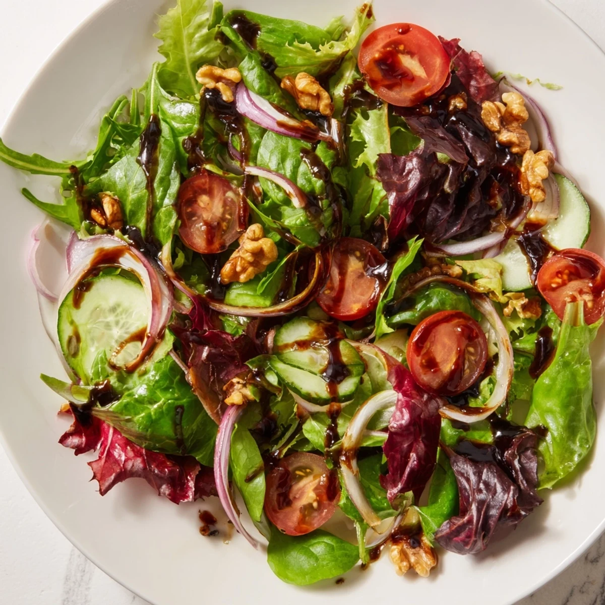 Vibrant quick Balsamic Vinegar Salad, tossed in glossy balsamic dressing with fresh, colorful ingredients.