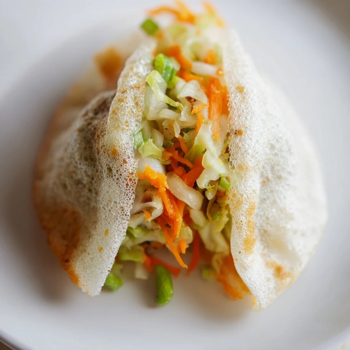 Golden, crispy Crispy Rice Paper Dumplings, served with savory dipping sauce, ready to enjoy.