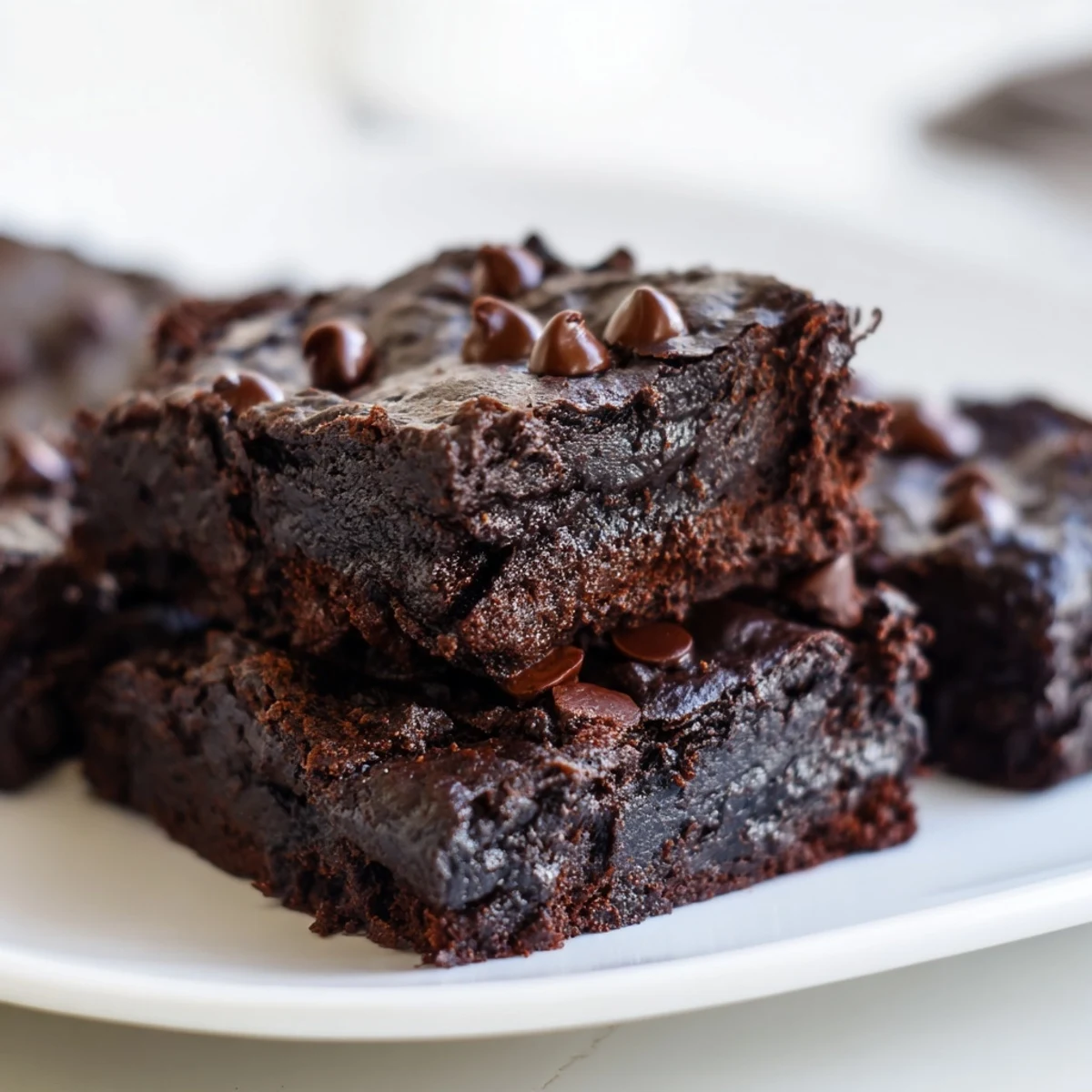 Fudgy Greek yogurt brownies, warm from the oven, with a satisfyingly rich chocolate aroma.