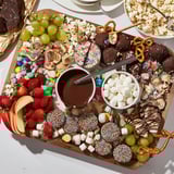 Festive dessert boards showcasing an array of snacks, candies, and delightful dips.  