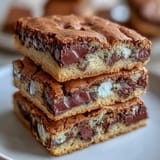 Cadbury Egg Cookie Bars with Pastel M&Ms bursting with colorful candy and gooey chocolate chunks, perfect for spring baking.