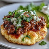 Delicious gluten-free cloud bread tacos served with seasoned taco meat and vibrant toppings.