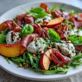 Vibrant Peach Burrata Prosciutto Salad with savory prosciutto and a balsamic drizzle.