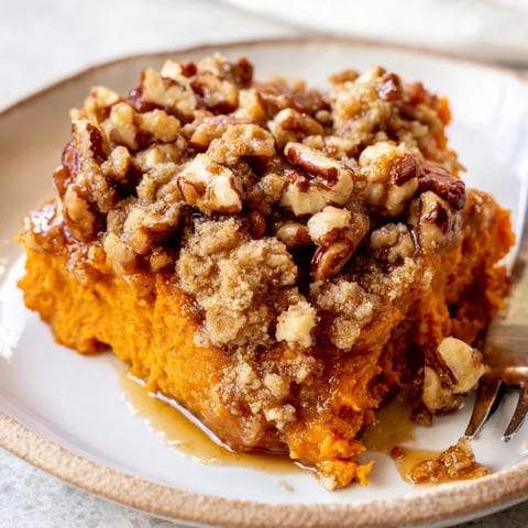 Creamy Maple Pecan Sweet Potato Casserole topped with crunchy pecans and warm spices.  