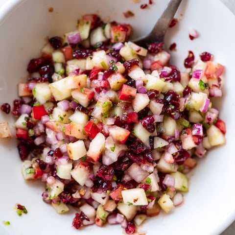 Vibrant pear and cranberry jalapeño salsa, perfect for summer picnics and barbecues.  