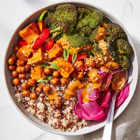 Vibrant Bold Sauce Drizzle Bowls filled with roasted veggies and flavorful sauces.  
