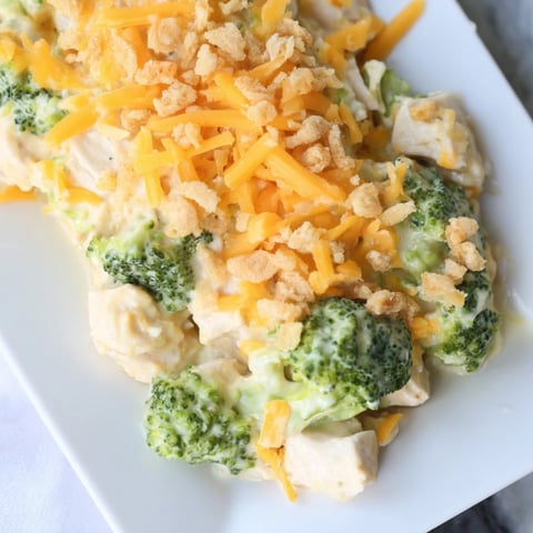 Golden, bubbly Chicken & Broccoli Cheddar Bake, revealing a creamy, cheesy, family-friendly dinner.