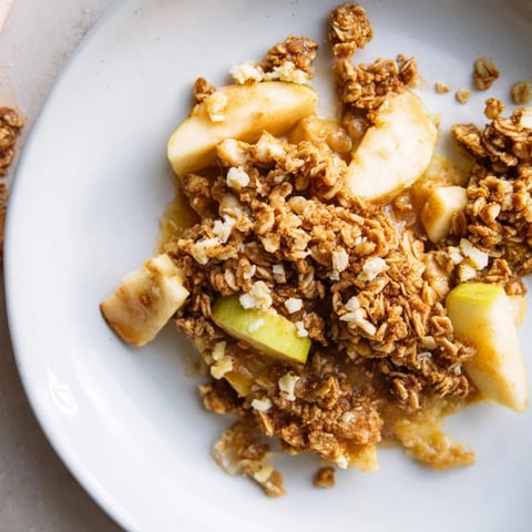 Warm Best Apple Crisp with golden crumble topping, ready to serve with a scoop of vanilla ice cream.
