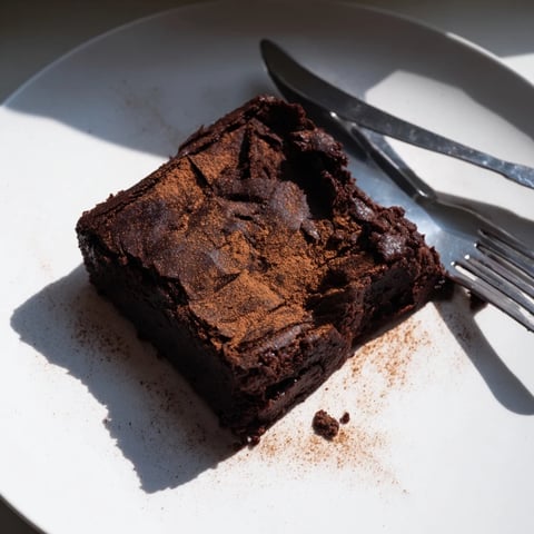Fudgy, dark Pumpkin Workout Brownies, perfect for a post-workout treat, cooling on a wire rack.