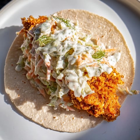Golden-brown Buffalo Chicken Smash Burger Tacos, bursting with flavor and topped with creamy ranch slaw.