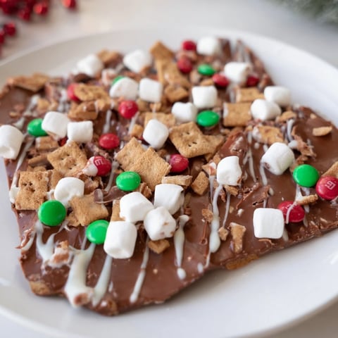 Quick Christmas Smores Bark, studded with colorful candies and melty marshmallows, ready to enjoy as a dessert.