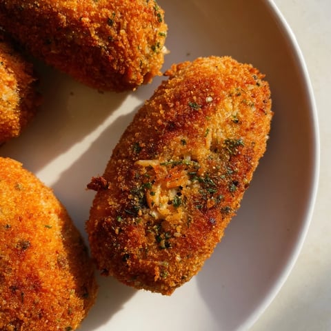 Golden-brown Air Fryer Spicy Ranch Chicken Croquettes, with a crispy breading ready to be devoured.