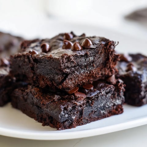 Fudgy Greek yogurt brownies, warm from the oven, with a satisfyingly rich chocolate aroma.