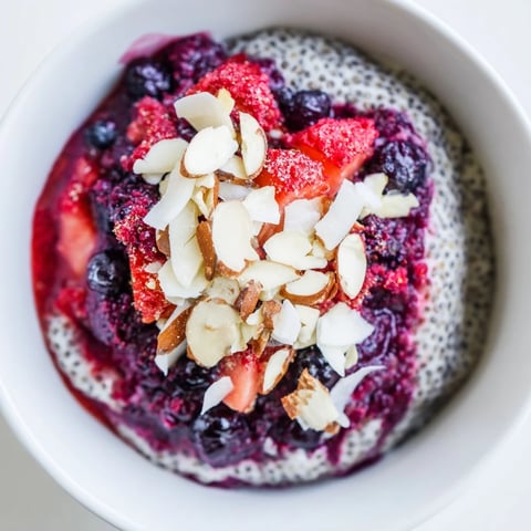 Creamy berry chia pudding layered with vibrant red berries, a healthy and delicious make-ahead breakfast.