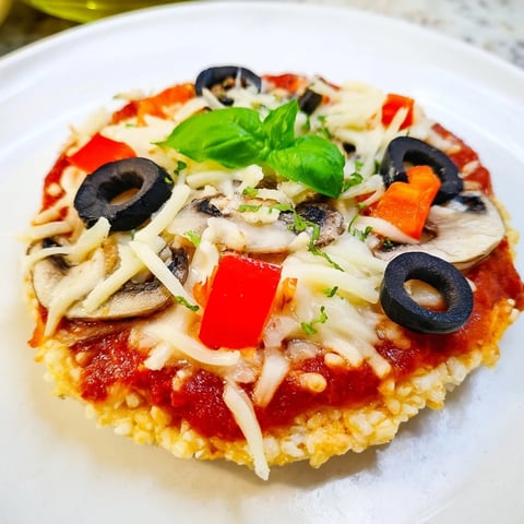 Golden, bubbly Rice Cake Pizza Squares with melted mozzarella, perfect for a quick snack.