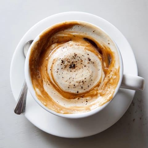 Savory Onion Latte combines rich espresso, creamy milk, and sweet caramelized onions.  