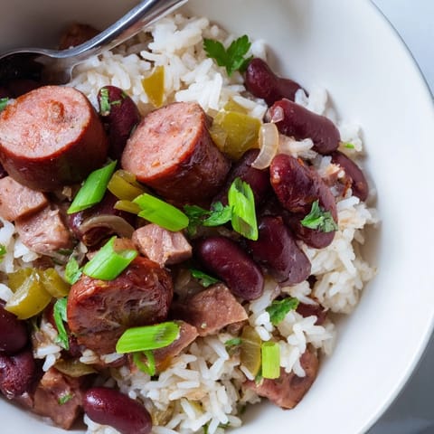 Aromatic Red Beans & Rice simmered with vegetables and topped with fresh parsley.  
