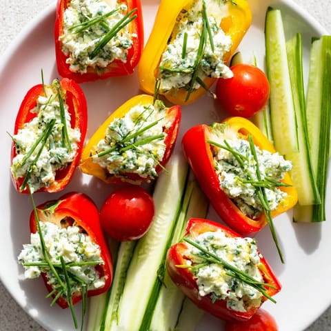 Freshly assembled Blooming Tulip Veggie Cups feature vibrant bell peppers and a delicious cream cheese filling for your appetizer.