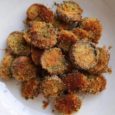 Close-up of golden brown Ranch-Seasoned Crispy Mushrooms, showing texture, a great vegetarian appetizer.
