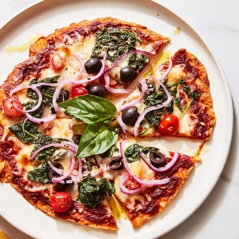 Perfectly melted mozzarella and vibrant toppings star in this crispy tortilla pizza shot.