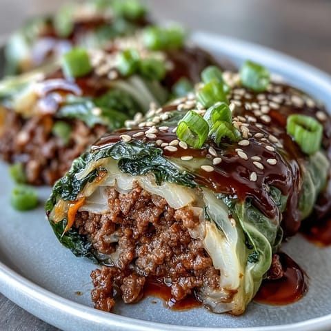Spicy Korean cabbage rolls filled with savory beef and served with a bold dipping sauce.