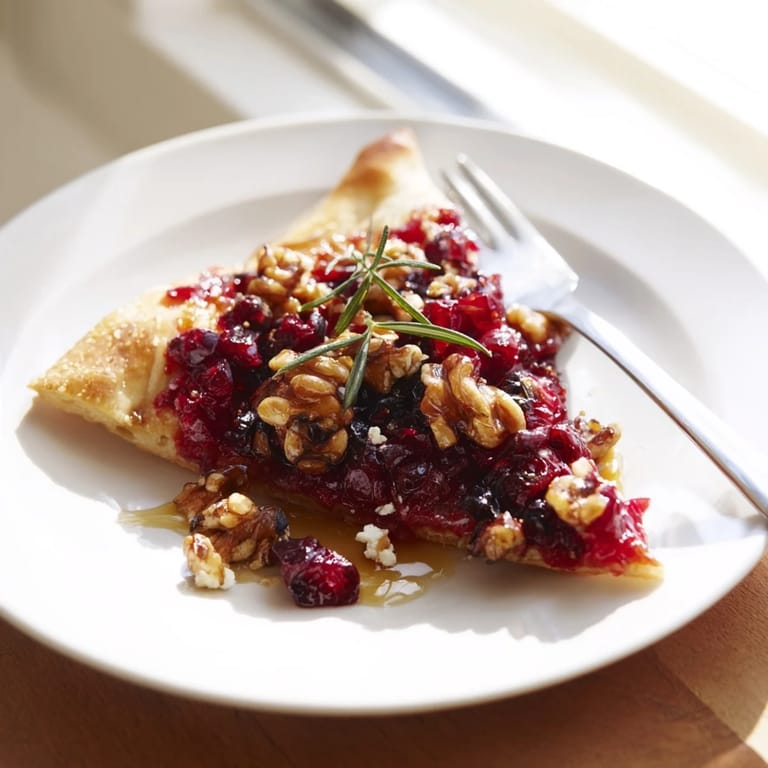 Golden baked cranberry walnut flatbread, ideal for sharing or as a savory snack.  