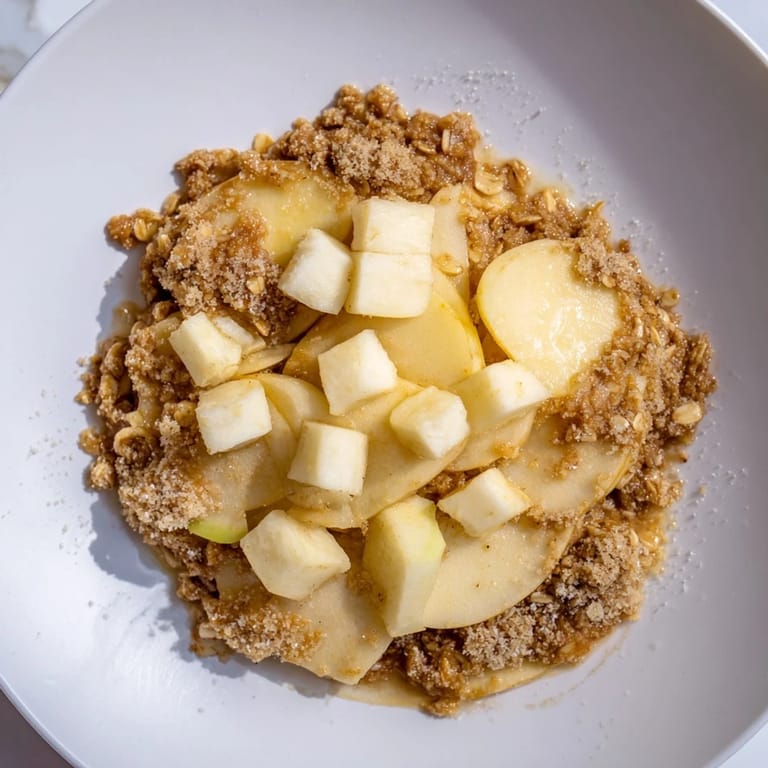 Freshly baked Best Apple Crisp: a comforting American dessert, perfect for autumn gatherings and celebrations.