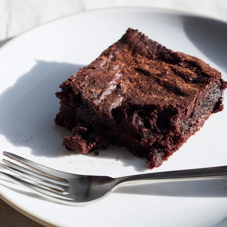 Warm, gooey Pumpkin Workout Brownies offer a satisfying texture and dark chocolate aroma.