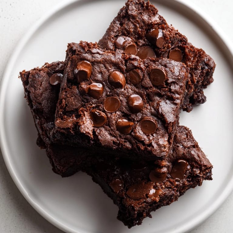A square of decadent Greek yogurt brownies, offering a rich chocolate flavor with a moist, delicious crumb.