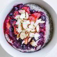 Creamy berry chia pudding layered with vibrant red berries, a healthy and delicious make-ahead breakfast.