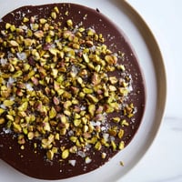 Delectable Pistachio Salted Caramel Bark, shimmering with flaky sea salt and studded with bright green pistachios.